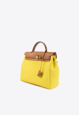 Herbag Zip 31 in Jaune Citron Toile and Naturel Sable Hunter with Palladium Hardware